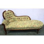 A 20th century pine framed chaise lounge, upholstered with buttoned upholstery, L: 160 cm. Not