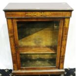 A Regency period inlaid walnut pier cabinet with single glazed door and two interior shelves, 76 x