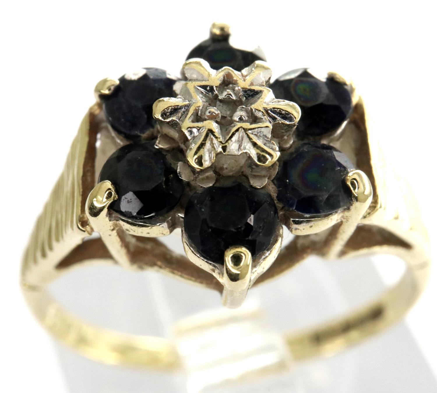 9ct gold flower ring set with sapphires and a central diamond, size L, 1.8g. P&P Group 1 (£14+VAT