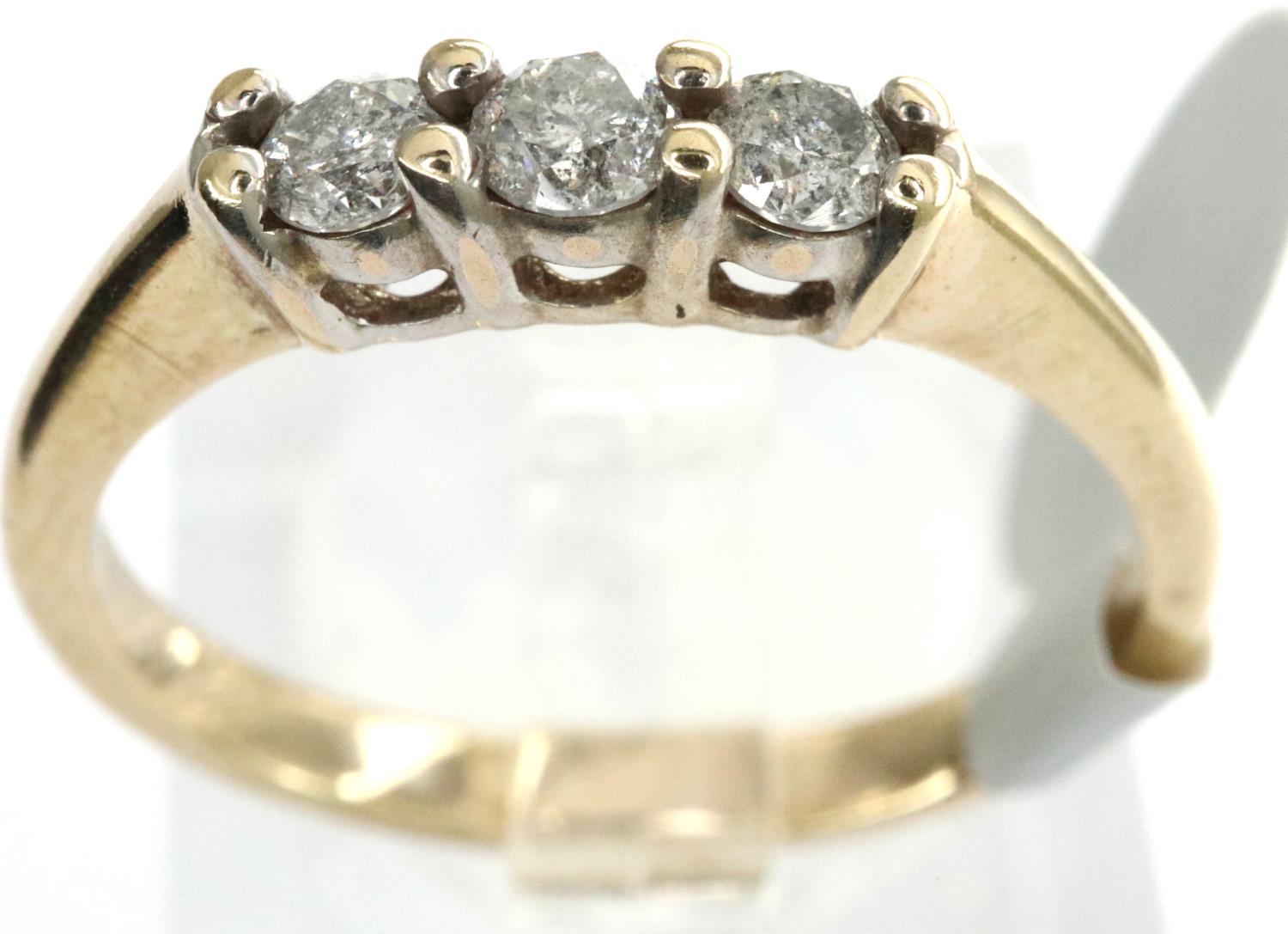 9ct gold three stone diamond ring, fully hallmarked, size L/M, 1.89g. P&P Group 1 (£14+VAT for the