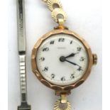 Buren: 9ct gold fifteen jewel ladies wristwatch on a rolled gold bracelet, working at lotting. P&P