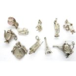 Ten assorted solid silver vintage charms, combined 28g. P&P Group 1 (£14+VAT for the first lot