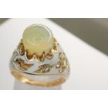 Presumed 18ct and white enamel ring set with large opal and diamonds, size M/O, 7.0g. P&P Group