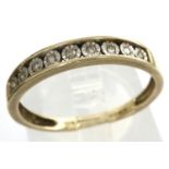 9ct gold band set with nine graduating diamonds, size N/O, 1.3g. P&P Group 1 (£14+VAT for the