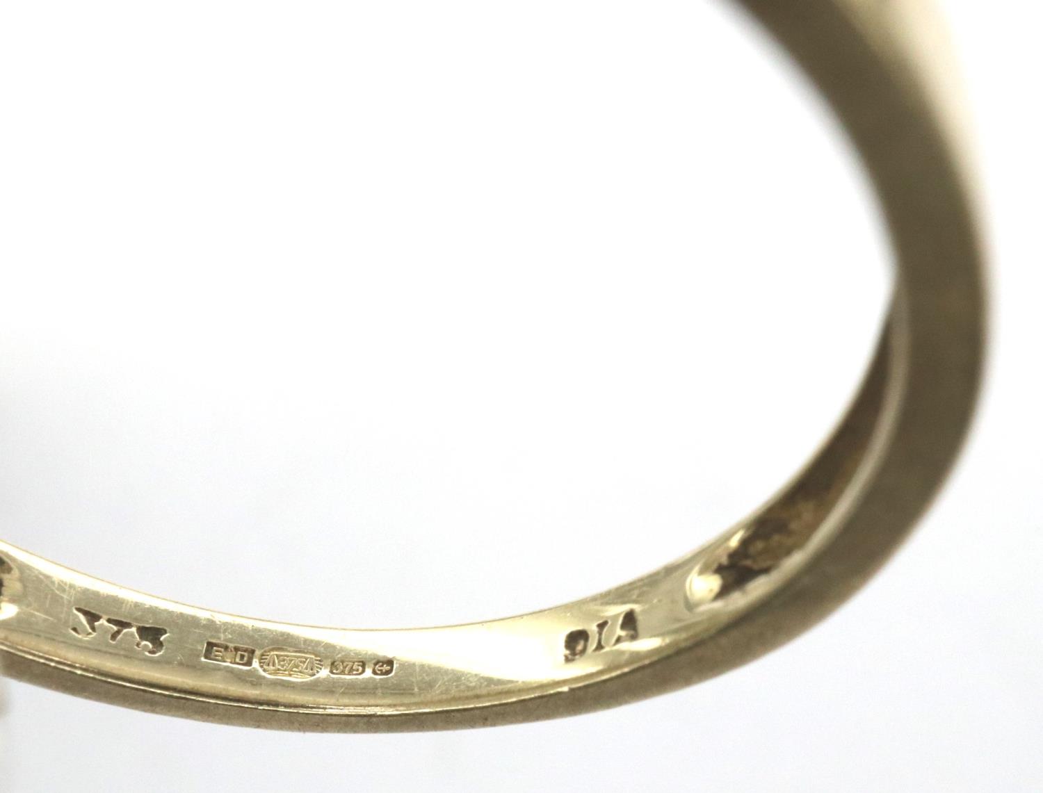 9ct gold band set with nine graduating diamonds, size N/O, 1.3g. P&P Group 1 (£14+VAT for the - Image 3 of 3