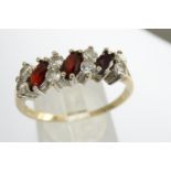 9ct gold ring set with garnets and CZ stones, size T, 2.2g. P&P Group 1 (£14+VAT for the first lot