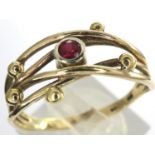 9ct gold ring set with a central ruby, size R/S, 2.5g. P&P Group 1 (£14+VAT for the first lot and £