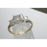 9ct gold solitaire ring set with three CZ stones and CZ shoulders, size R, 1.9g. P&P Group 1 (£14+