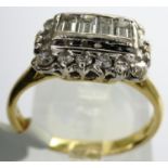 18ct gold fancy diamond cluster ring with four central emerald cut diamonds, approximately 0.50ct,