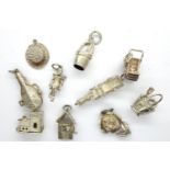 Ten assorted solid silver vintage charms, combined 28g. P&P Group 1 (£14+VAT for the first lot