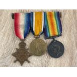 SET OF THREE WW1 MEDALS ENSCRIBED "113 - GNR.J.H. DAVIES R.F.A"