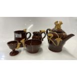 CLEVERLY POTTERY WARES COMPRISING TEAPOT, MUG, JUG, EGG CUP, SUGAR BOWL, ALL DECORATED WITH MOUSE