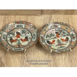 A PAIR OF SMALL DECORATED CHINESE PLATES 11CM DIAMETER. ONE HAS BEEN REPAIRED