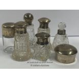 SIX SMALL SILVER TOPPED GLASS BOTTLES AND SILVER LID. TALLEST 9.5CM HIGH