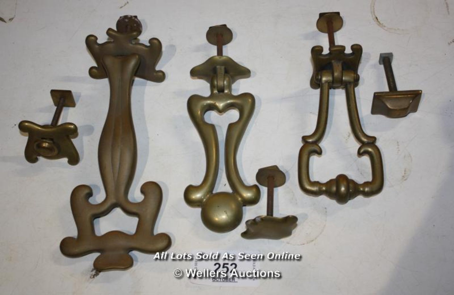 THREE ARTS AND CRAFTS BRASS DOOR KNOCKERS