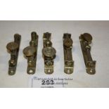 FIVE BRASS WINDOW STAYS