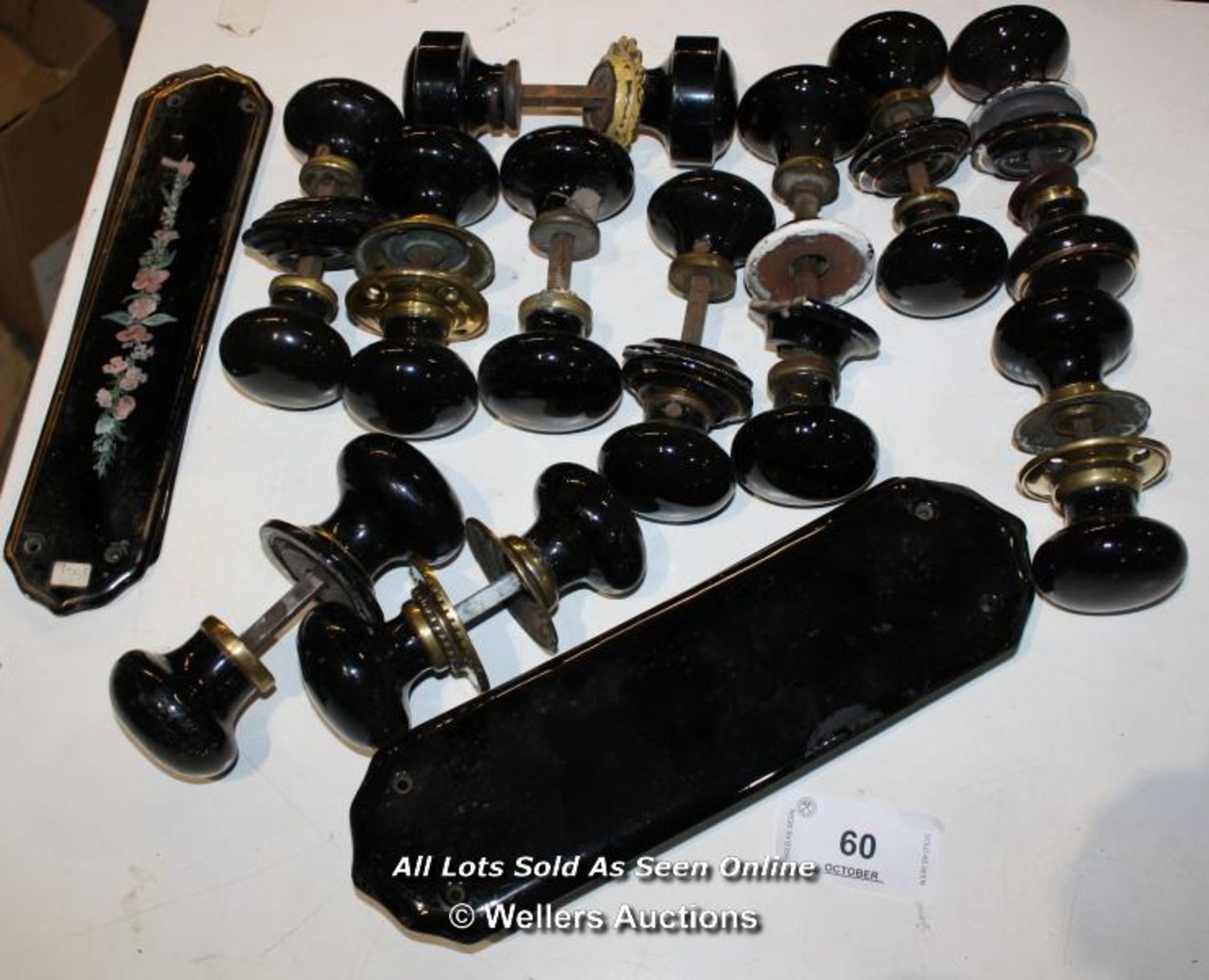 ELEVEN PAIRS OF BLACK CHINA HANDLES AND EIGHT FINGER PLATES