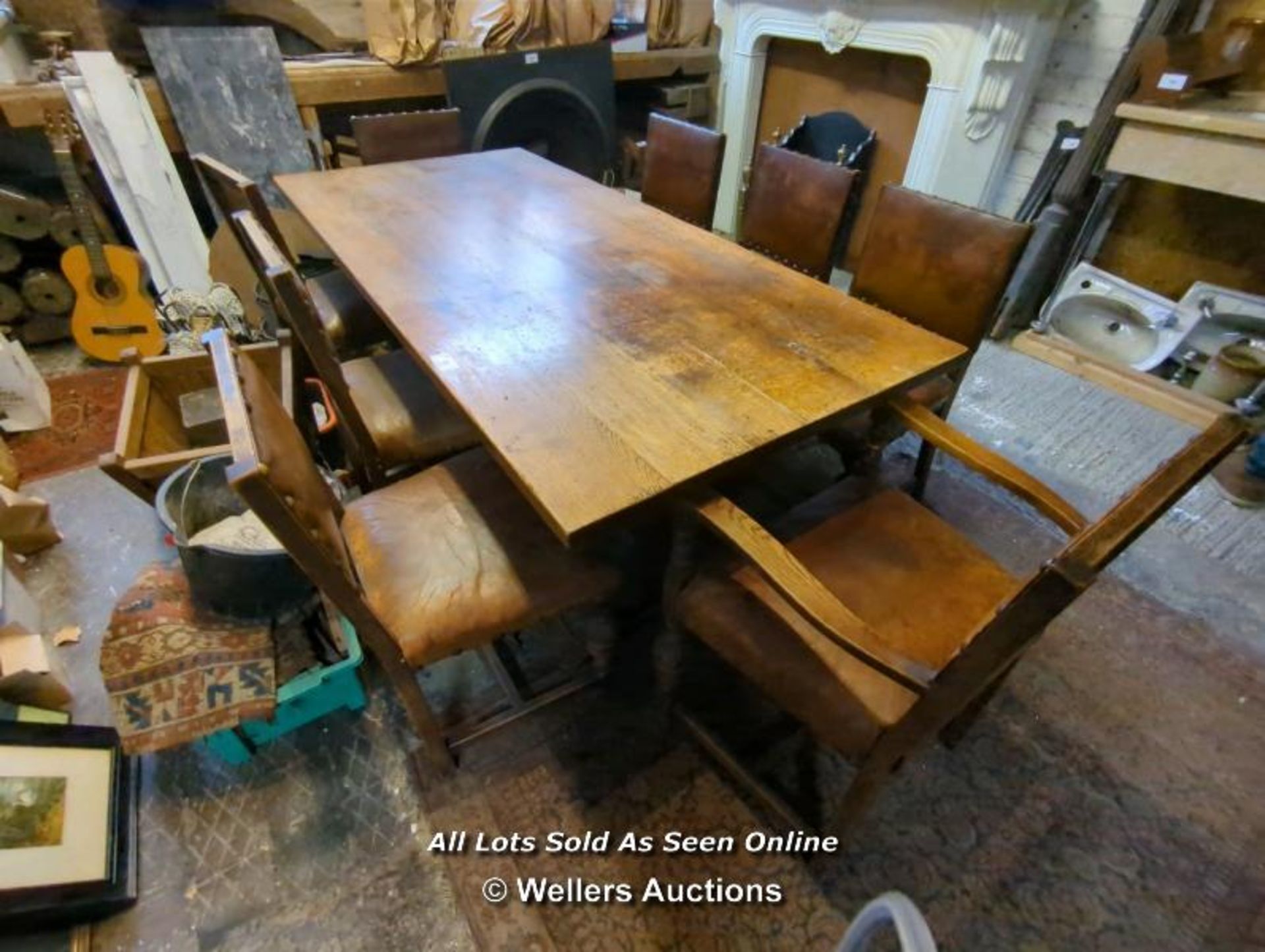 OAK TABLE AND EIGHT LEATHER BOUND CHAIRS - 29" H X 78" L X 3' W