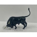 A BRASS PAINTED FIGURE OF A BULL, 9CM HIGH (TAIL)