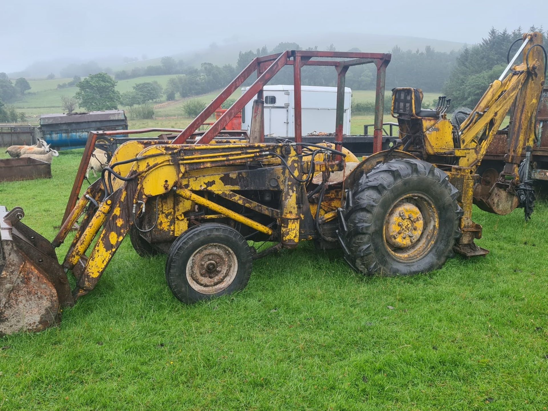 M F DIGGER WITH 3 CYLINDER ENGINE. STARTS AND DRIVES WELL.