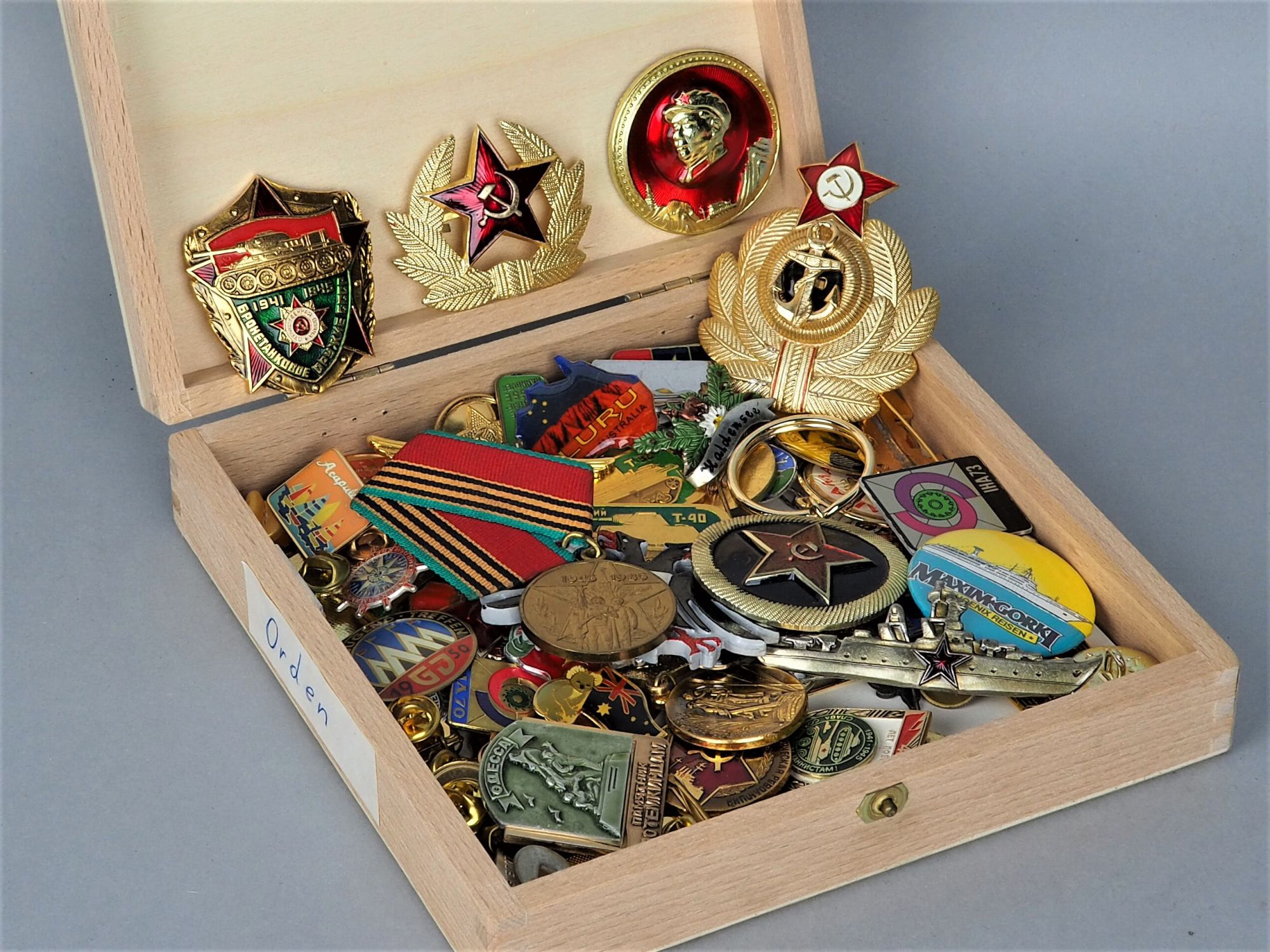 Mixed lot of USSR badges, pins, and cap effects