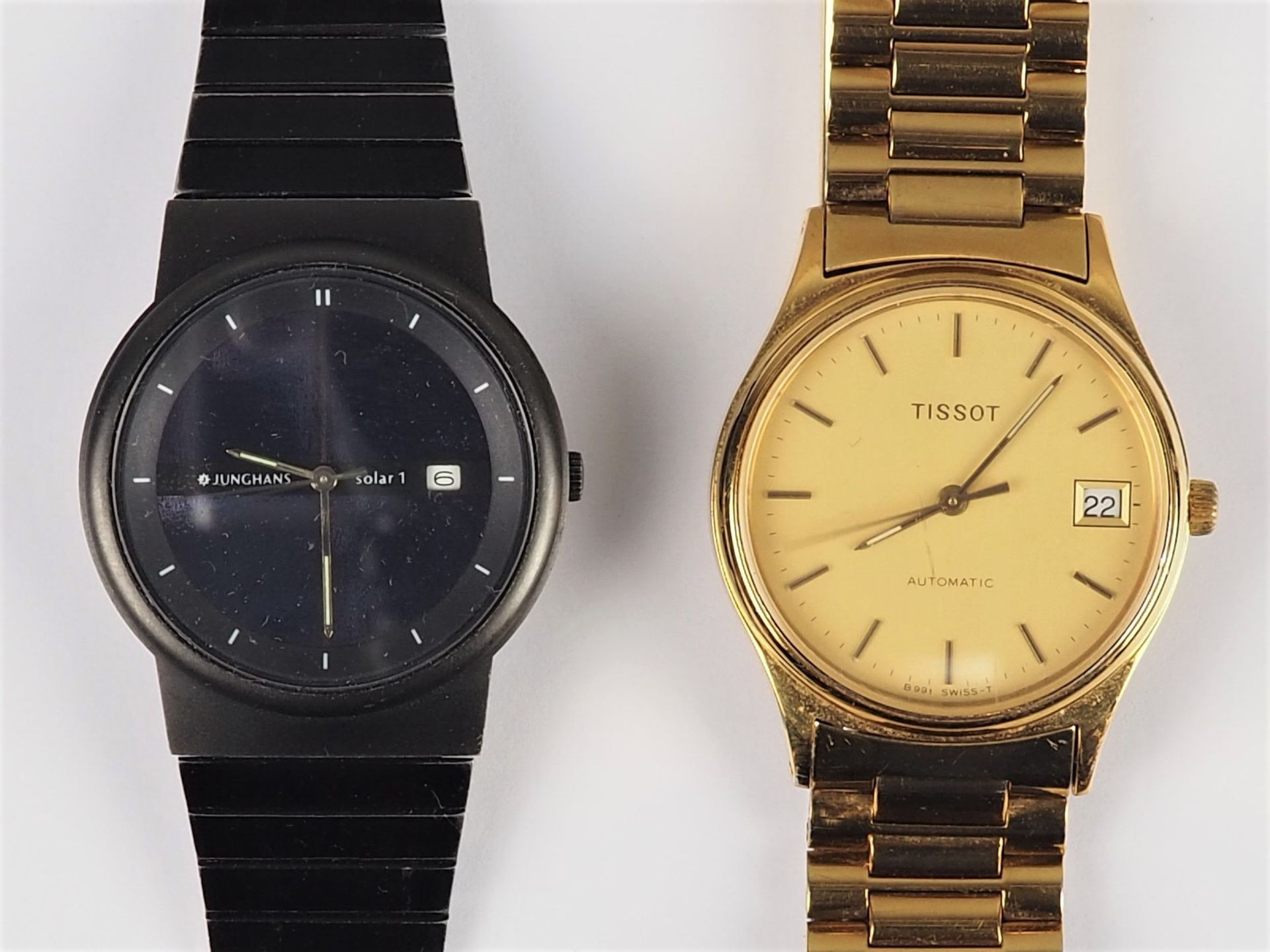 2 Armbanduhren, Tissot Automatik vergoldet und Junghans Solar 1
