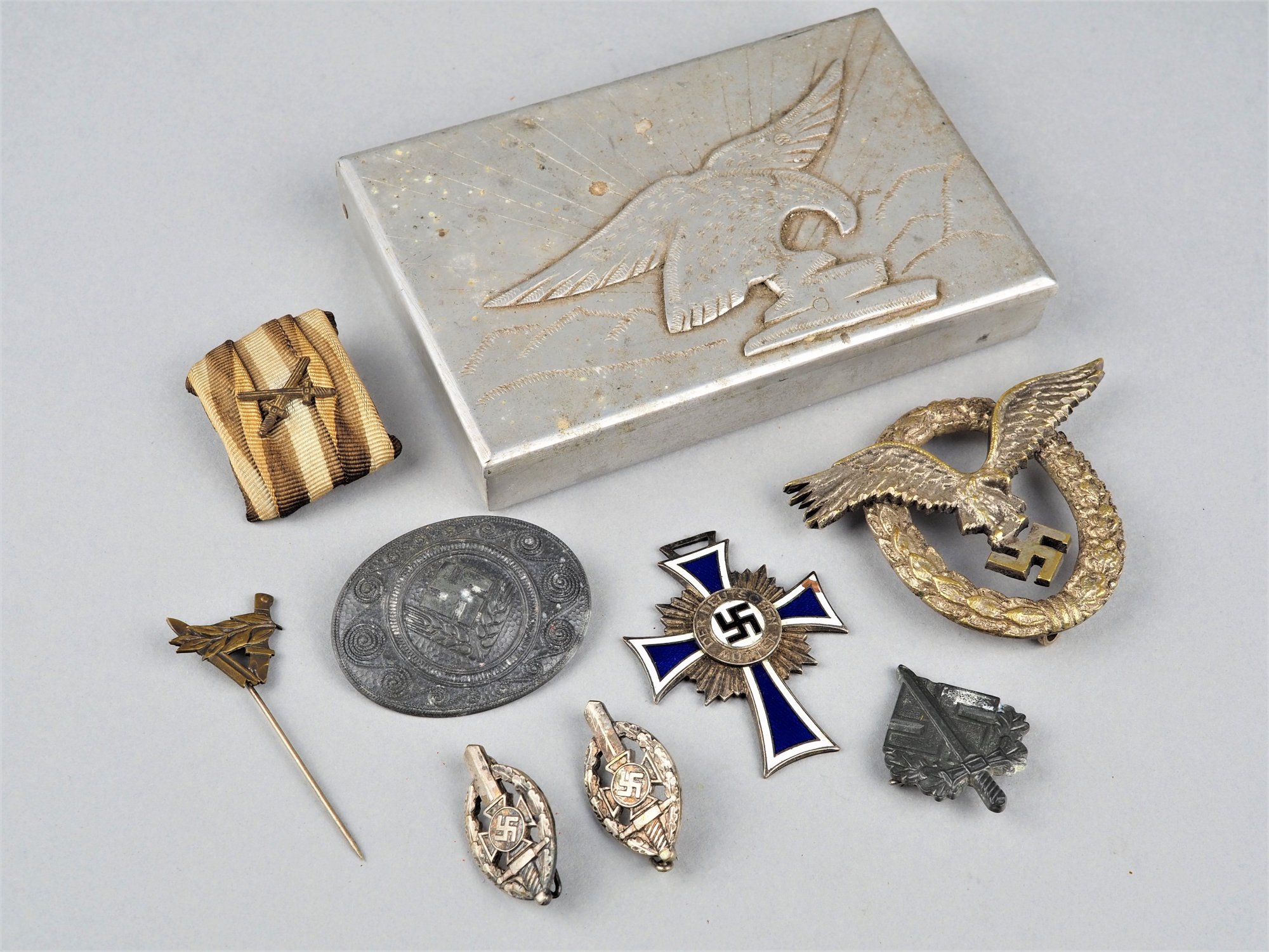 Third Reich, mixed lot NS badges in eagle box