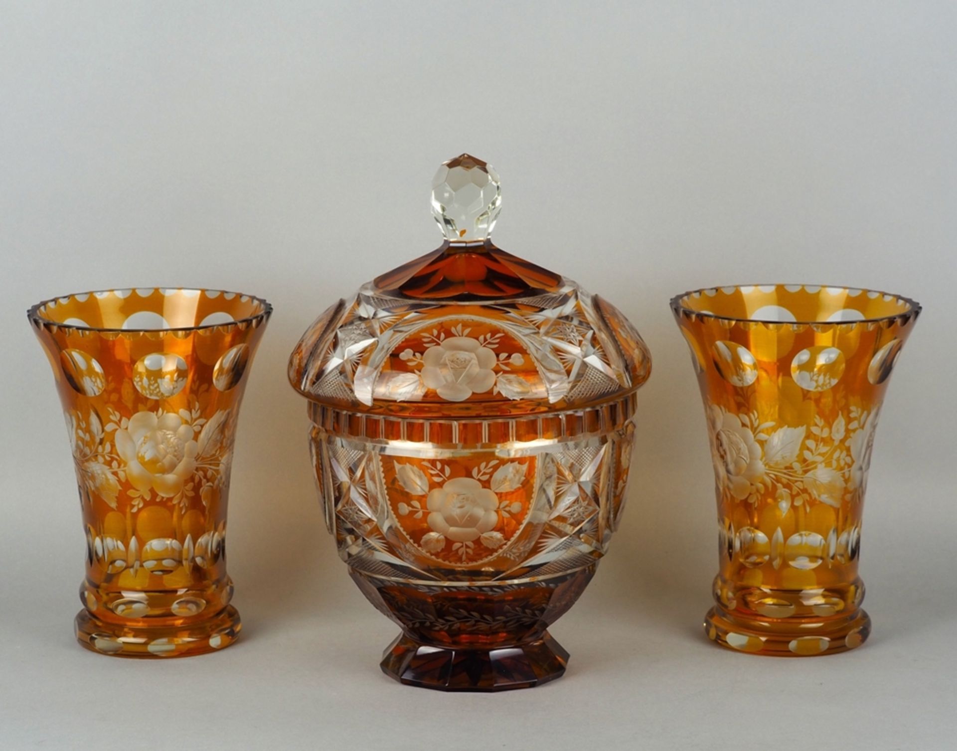 Two vases and one confectionary bowl with lid made of glass, Bohemia, mid-20th century. 