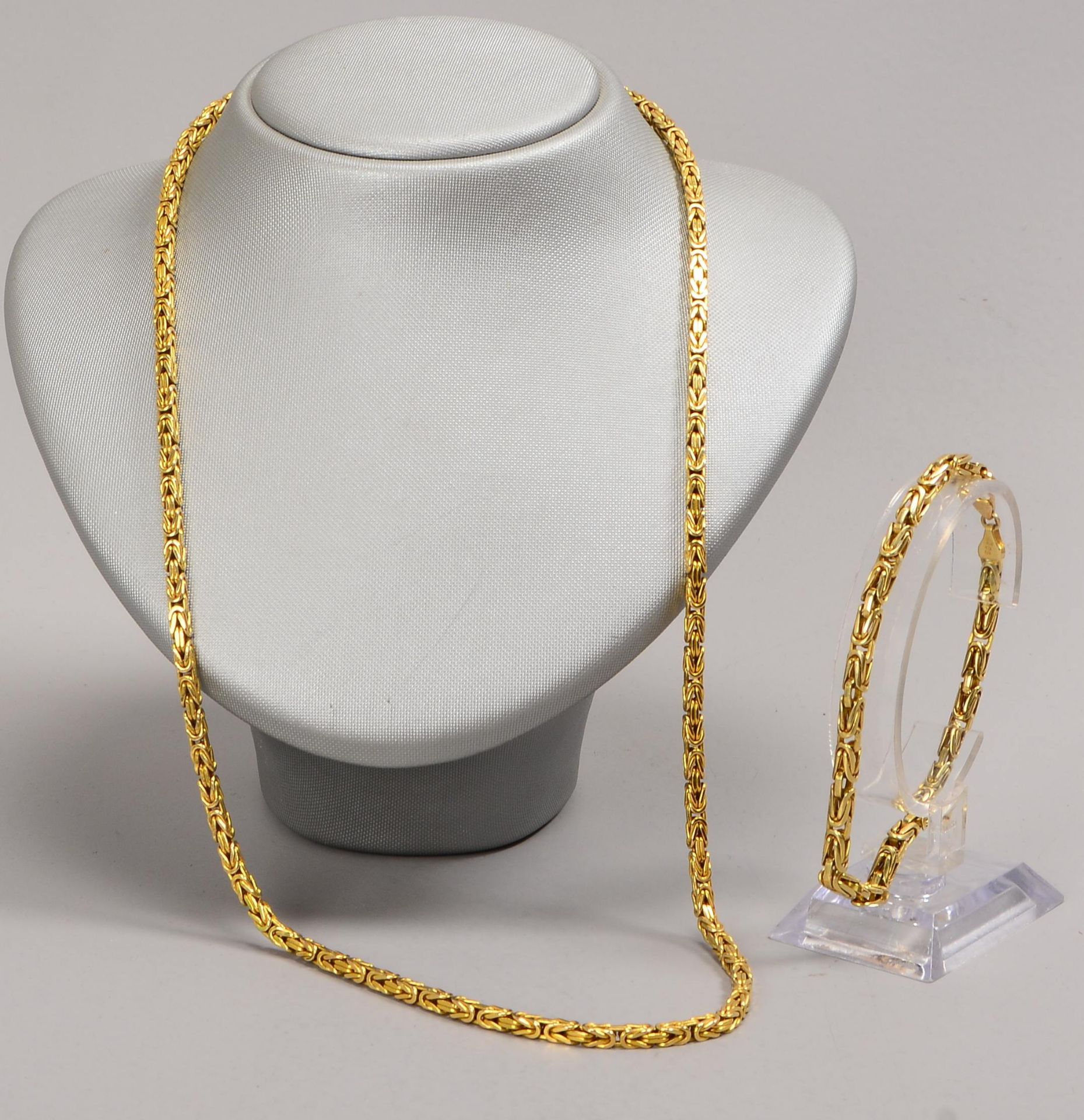Schmuckset, 585 GG (gestempelt), 2-teilig: Königskette und Armband, Teile jeweils mit Karabinerschli