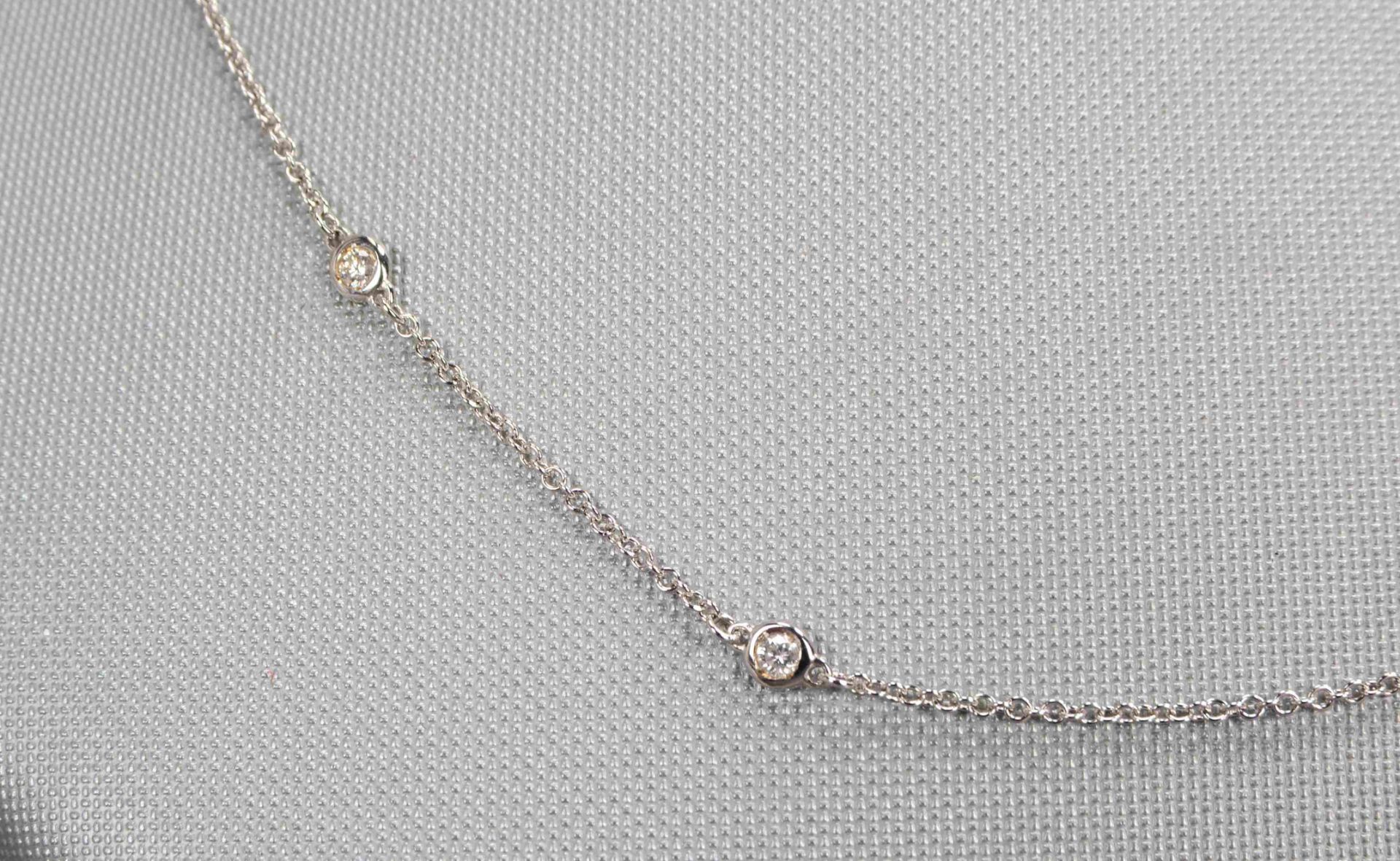 Halskette, 750 WG (gestempelt), mit 6-fachem Brillantbesatz/zusammen ca. 0,22 ct; L&auml;nge 44 cm - Image 2 of 2