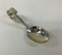 A modernist silver caddy spoon. Est. £30 - £40.