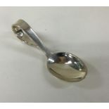 A modernist silver caddy spoon. Est. £30 - £40.