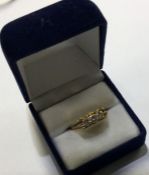 An 18 carat gold and diamond mounted three stone r