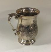 A heavy chased silver christening cup on pedestal