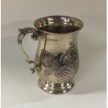 A heavy chased silver christening cup on pedestal