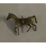 A silver model of a horse. Approx. 20 grams. Est. £20 - £30.