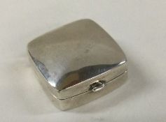 A rectangular hinged silver pill box. Approx. 9