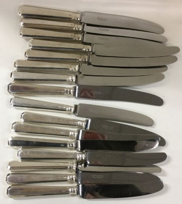 A set of eight (+eight) cast silver knives. Retail