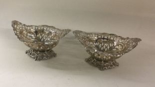 A pair of chased silver bonbon dishes. Birmingham.