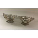 A pair of chased silver bonbon dishes. Birmingham.
