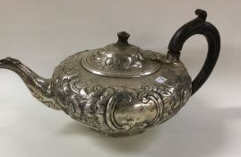 A heavy embossed silver teapot. London. By WP. App