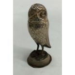 A heavy Continental silver figure of an owl in sta