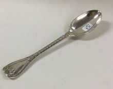 A silver palm pattern preserve spoon. London 1868.