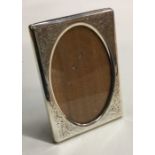 A good silver engraved picture frame with floral d