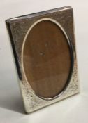 A good silver engraved picture frame with floral d