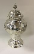 A Victorian silver heavy chased sugar caster. Lond