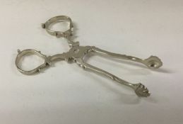 A pair of silver ice tongs.London 1928. By JB Chat