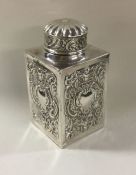 A chased Victorian silver tea caddy. London 1891.