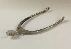 A pair of silver wishbone tongs. Birmingham 1910.