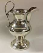 CHESTER: An Edwardian silver cream jug of shaped f